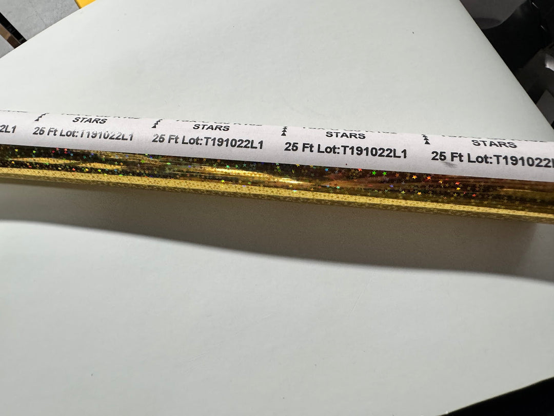 Mill band on the gold holographic stars foil roll showing the original $17.00 price sticker