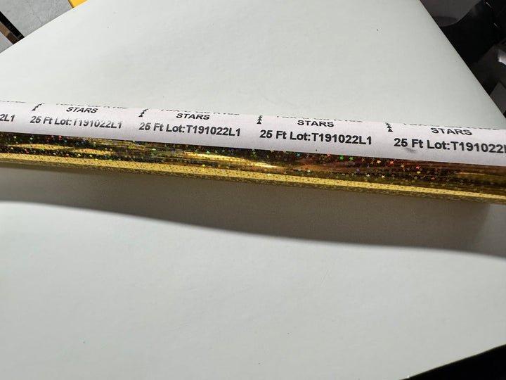 Mill band on the gold holographic stars foil roll showing the original $17.00 price sticker