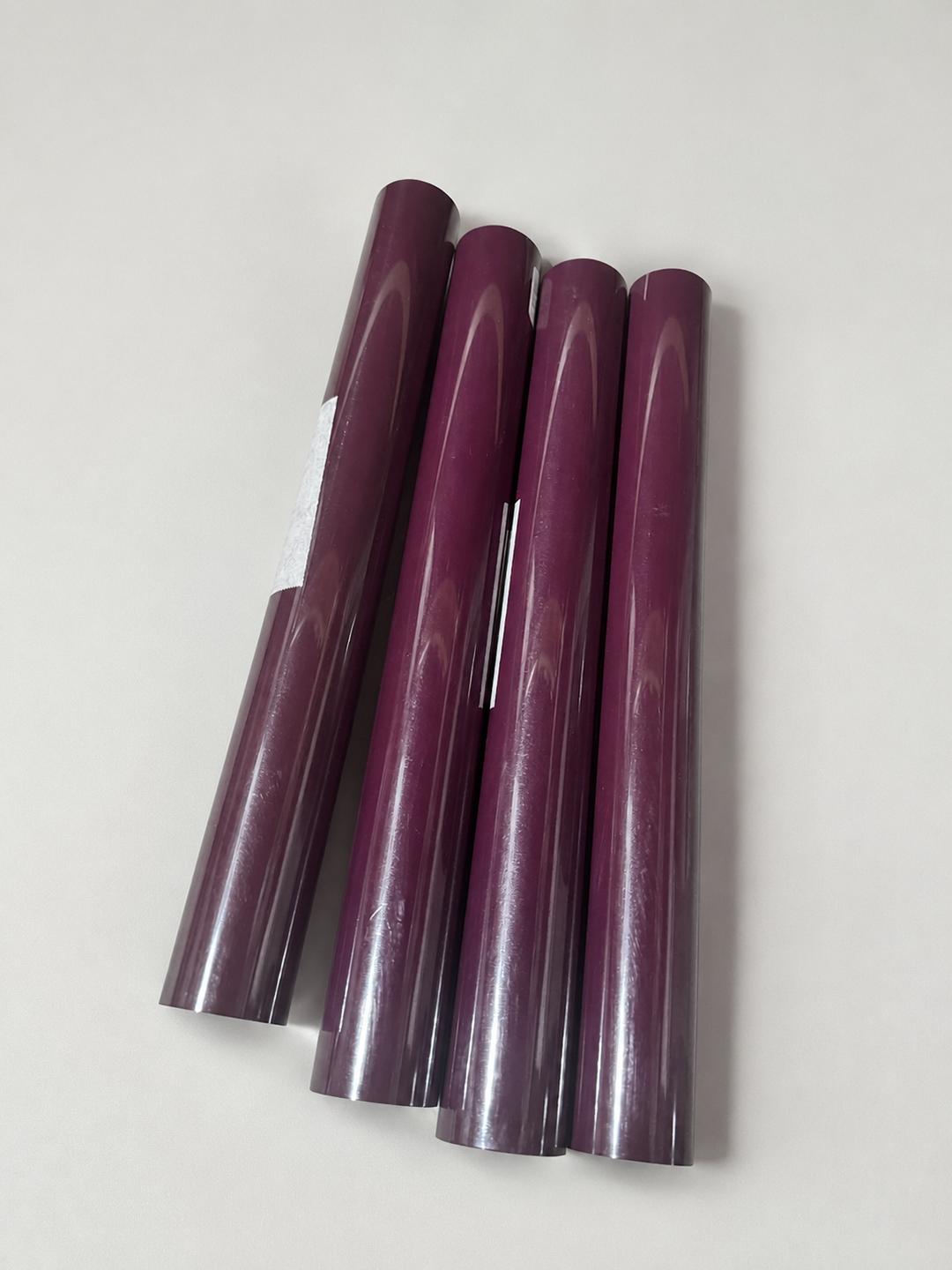 Group of rolls of Siser heat transfer vinyl in a deep plum shade