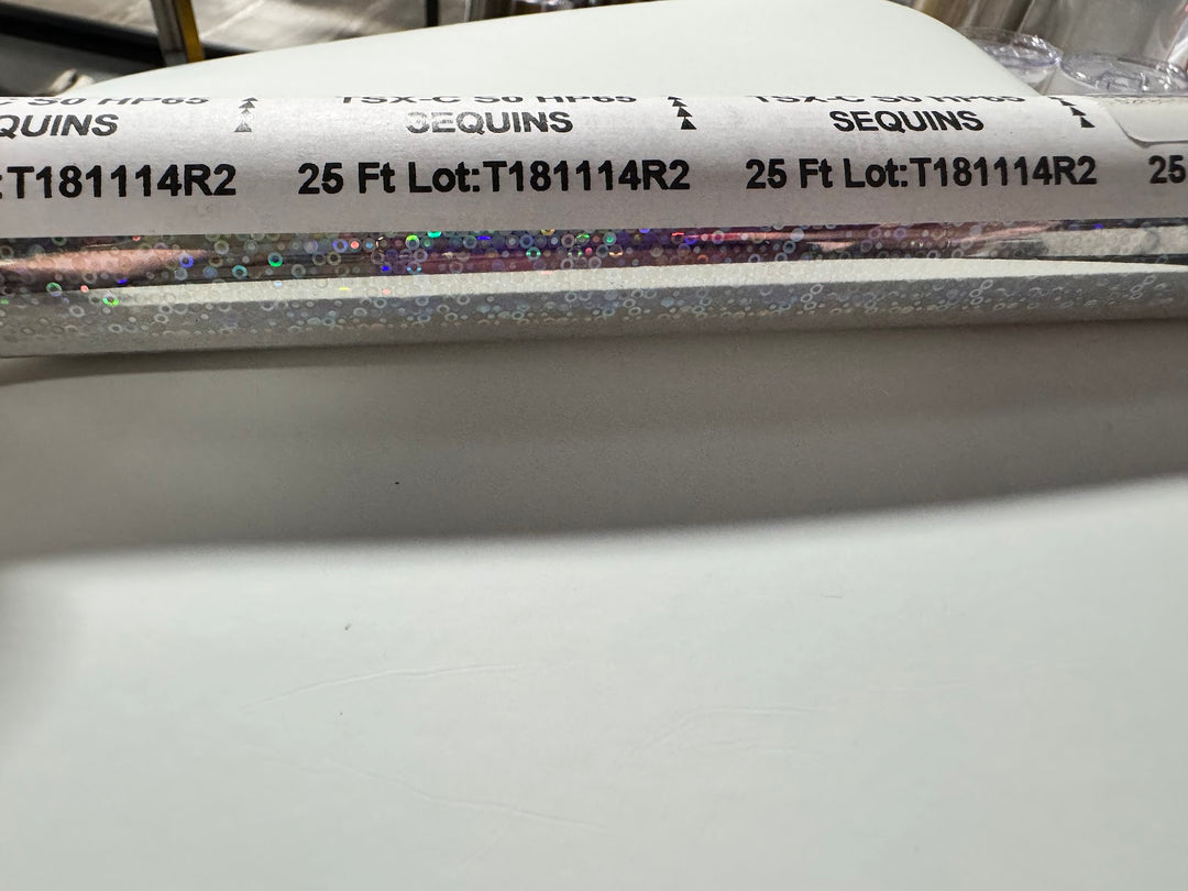 Roll of StarCraft Electra Foil in Silver Holographic Sequins with an iridescent circle pattern
