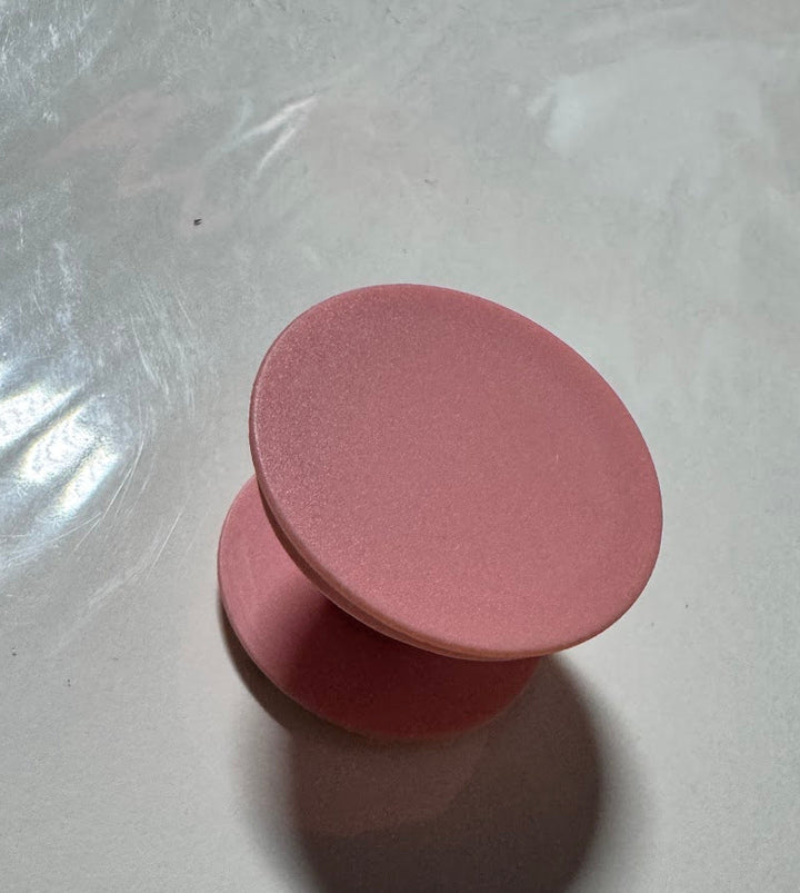 Matte dusty-rose collapsible phone grip blank, expanded, showing the flat top disc