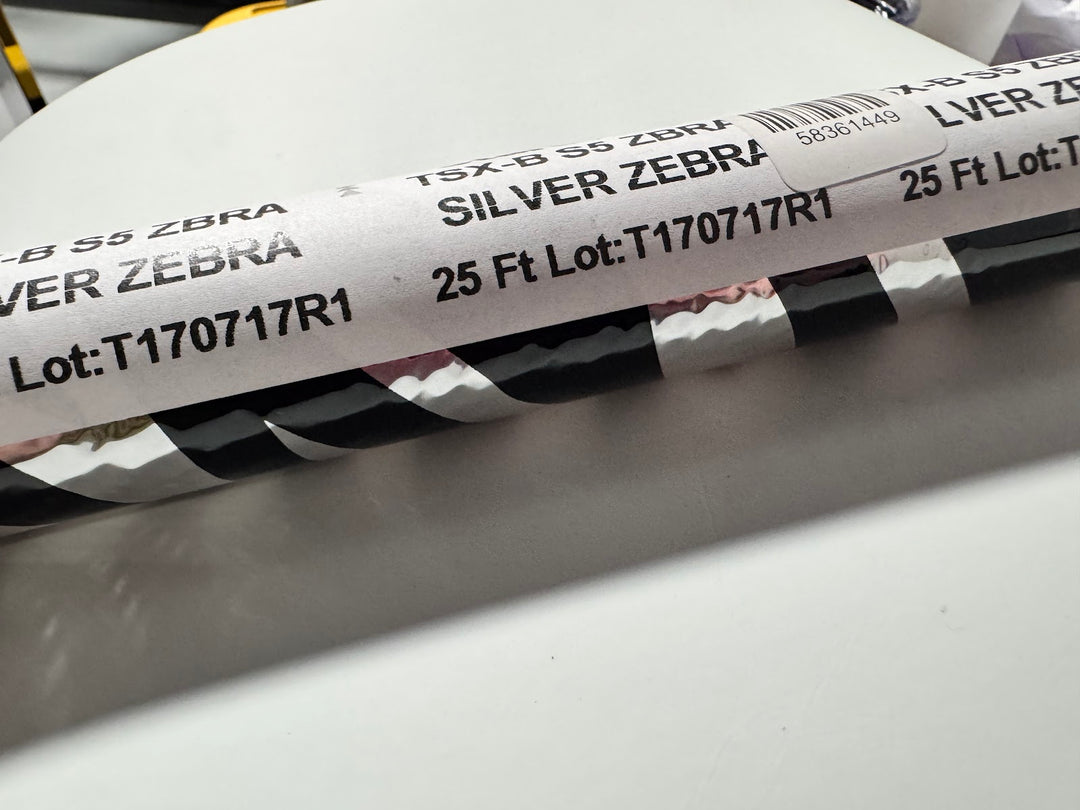 Roll of StarCraft Electra Foil in Silver Zebra, silver foil with black zebra striping