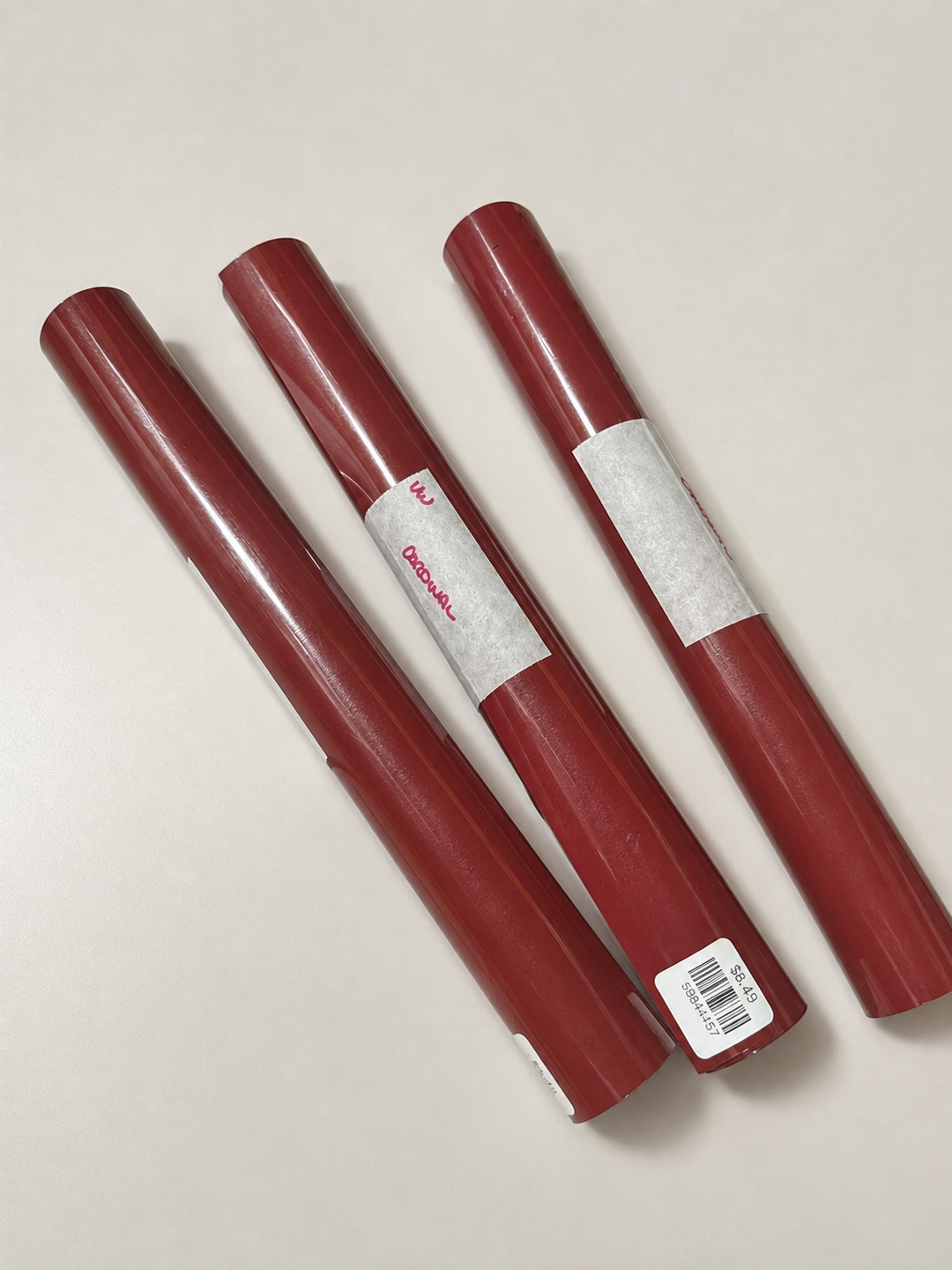 Rolls of Siser EasyWeed heat transfer vinyl in Cardinal, a deep burgundy red