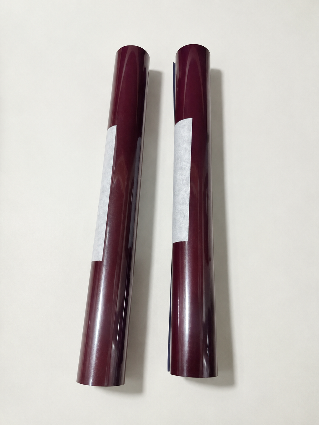 Two rolls of Siser heat transfer vinyl in a burgundy shade