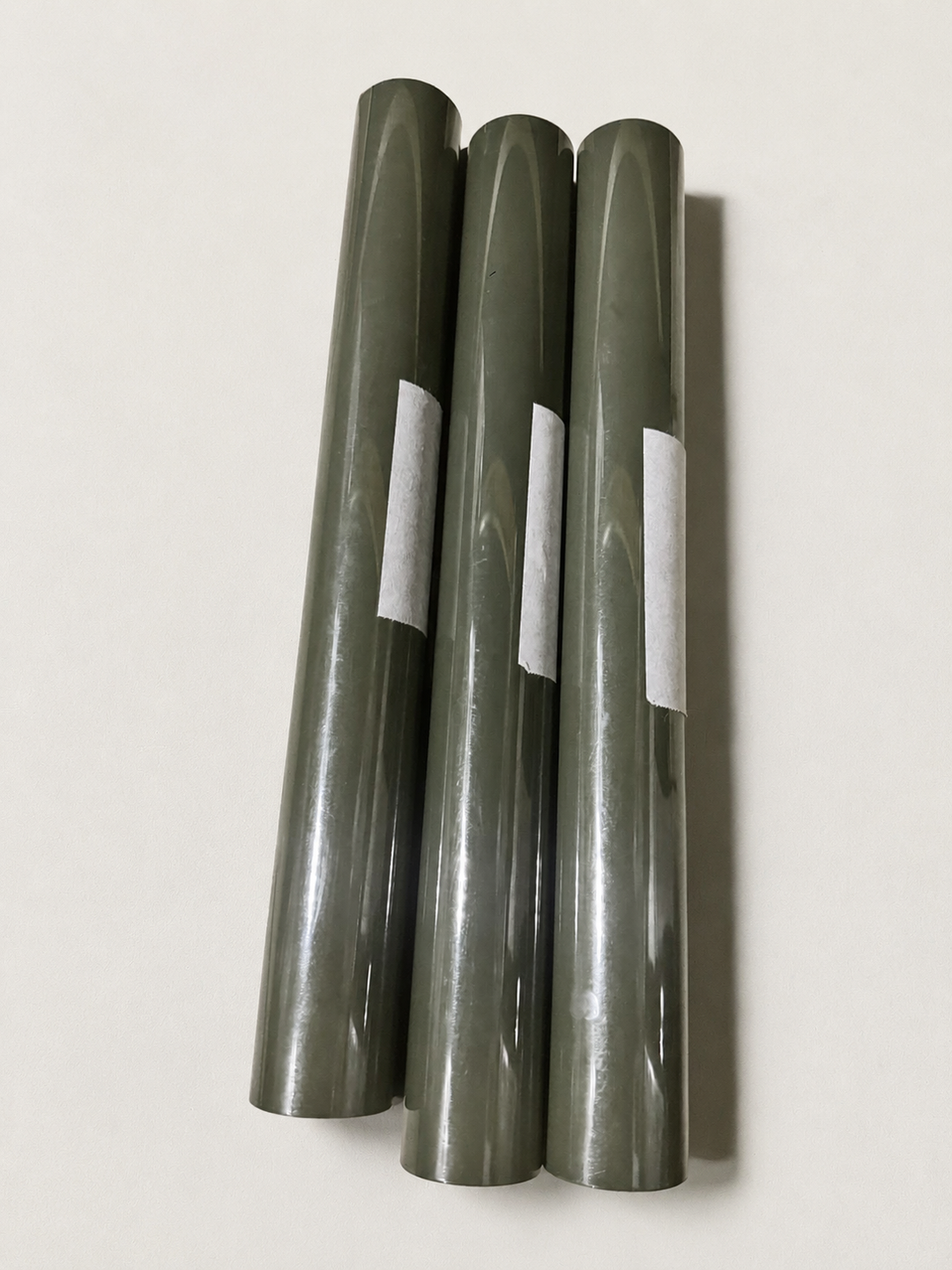 Three rolls of Siser heat transfer vinyl in a dark olive shade