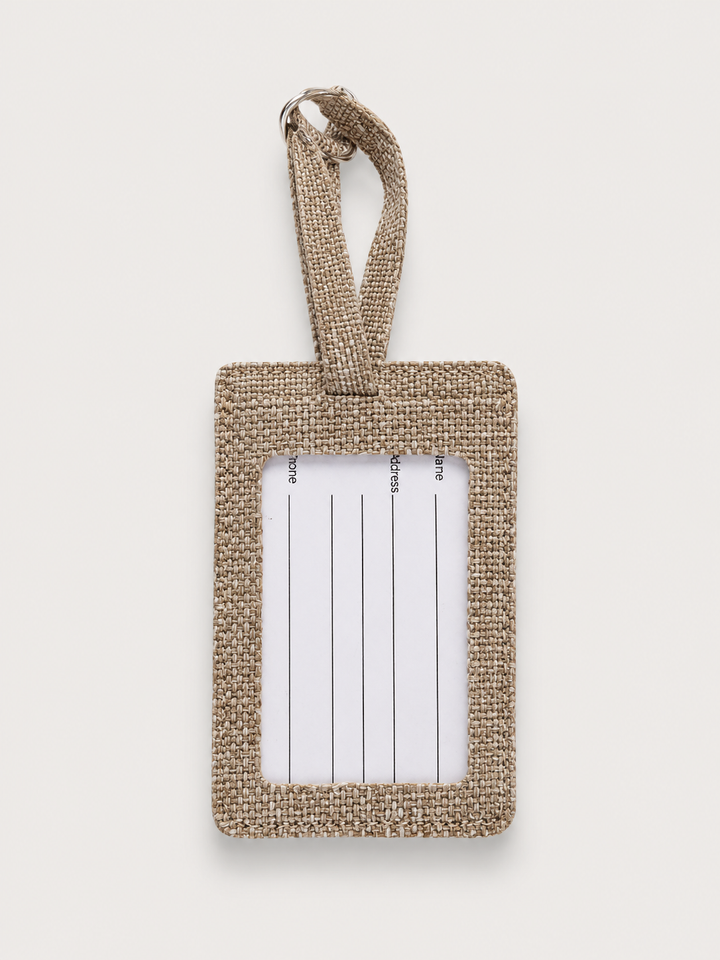 Front of a burlap luggage tag blank with a clear window over a ruled insert card
