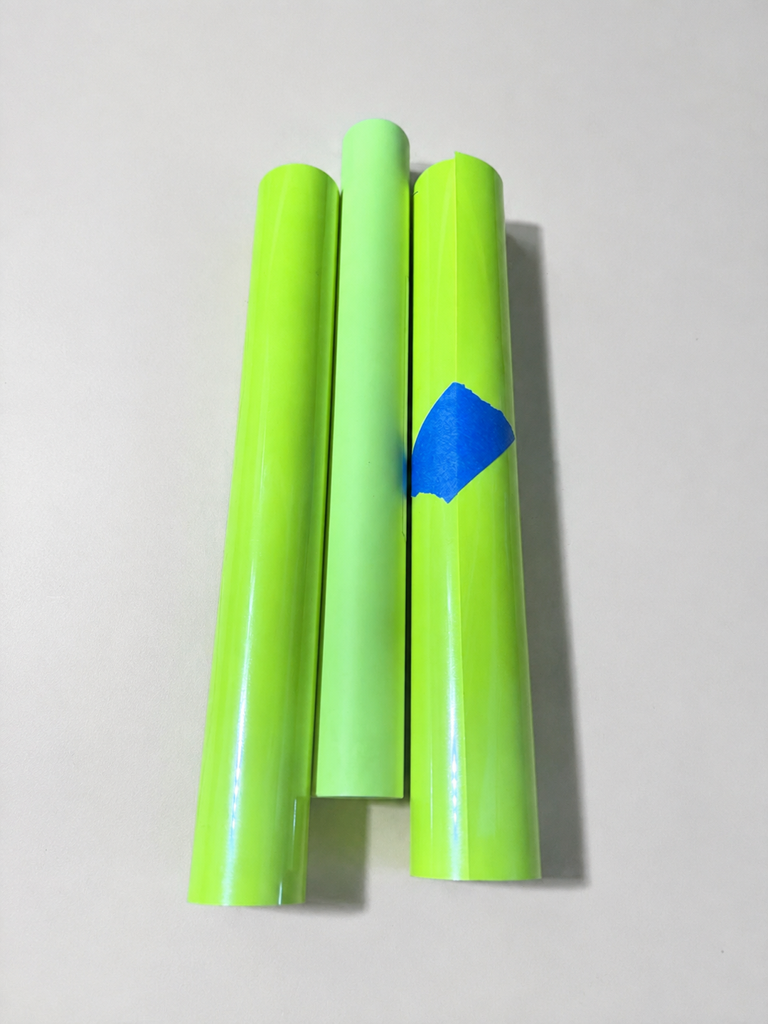 Three rolls of Siser heat transfer vinyl in a neon lime shade