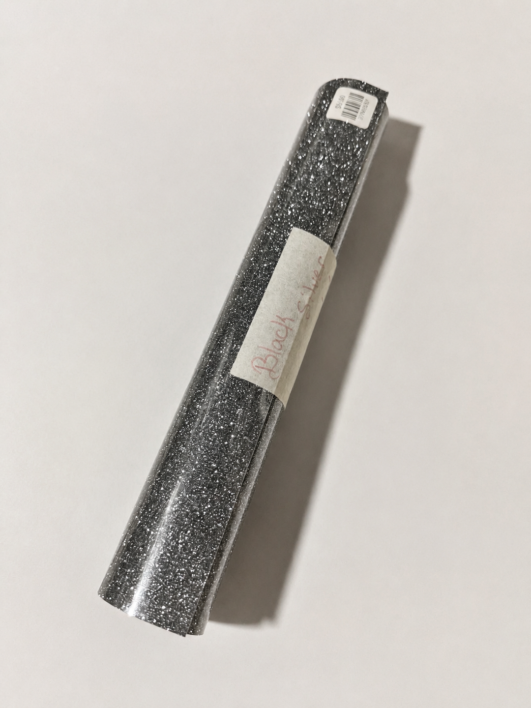Single roll of Siser Glitter heat transfer vinyl in Black Silver