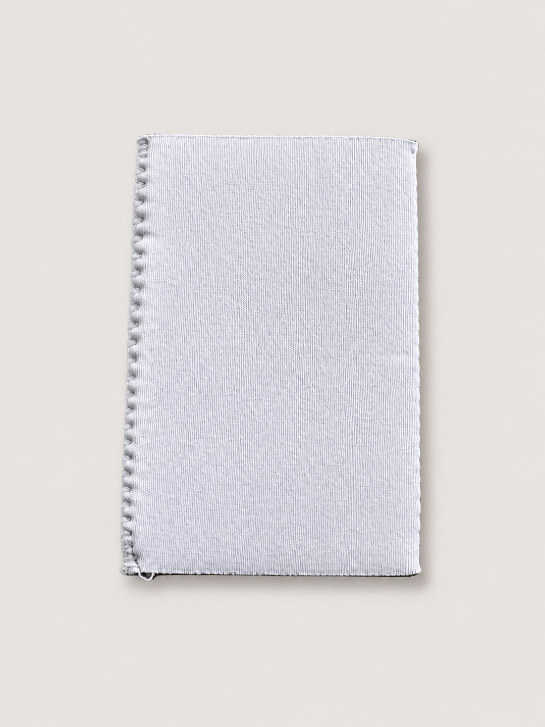 Pale grey ribbed knit can cooler blank shown flat with a serged seam