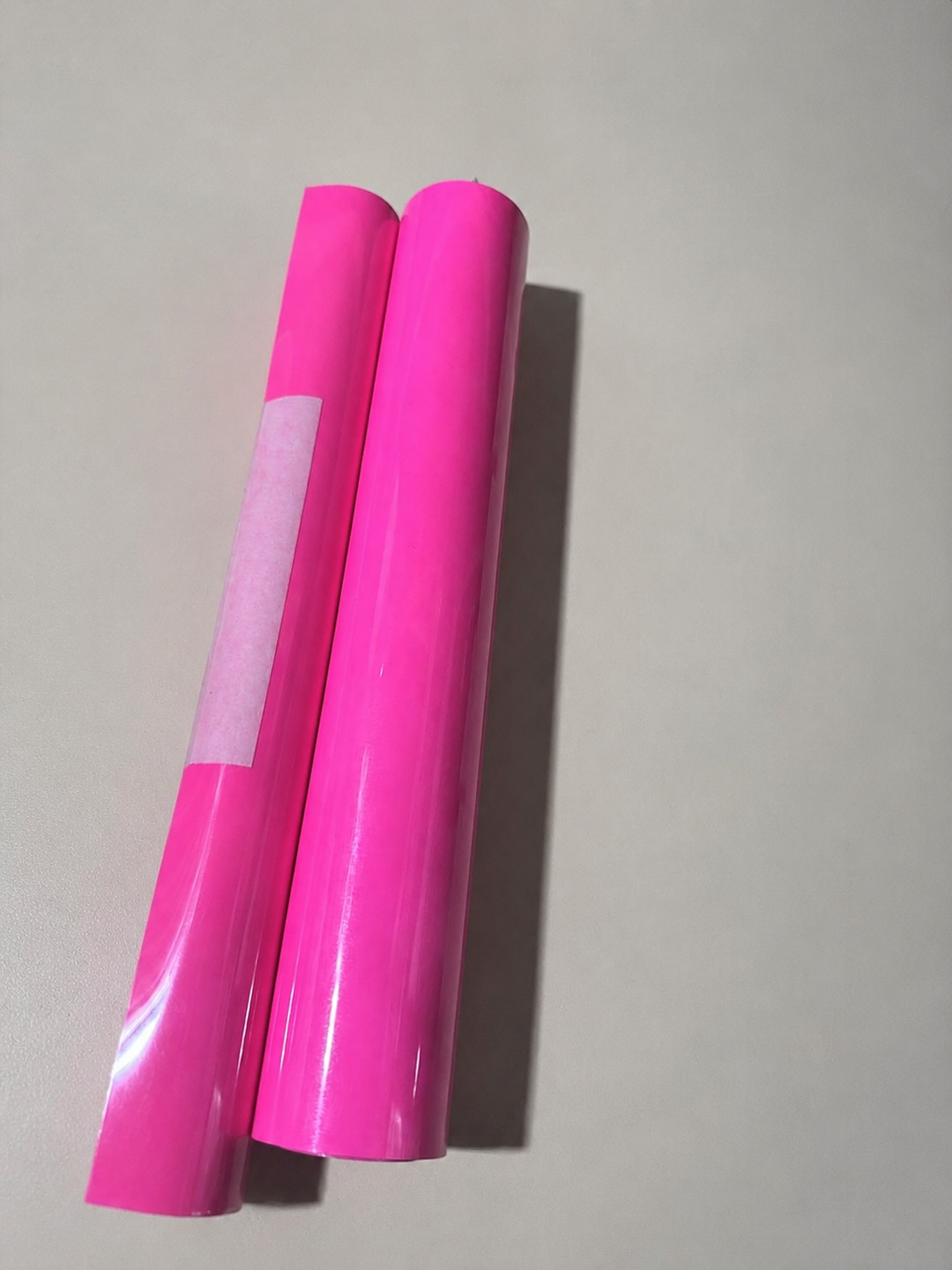 Rolls of Siser EasyWeed heat transfer vinyl in Hot Pink, a bright neon-leaning pink