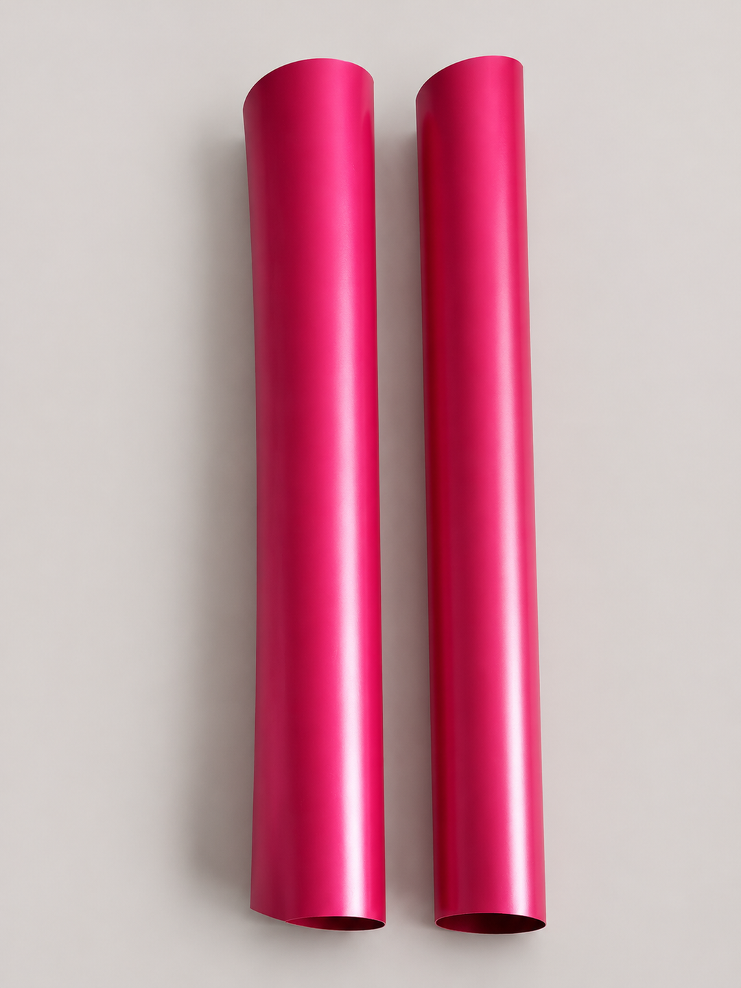 Two one yard rolls of magenta satin heat transfer vinyl