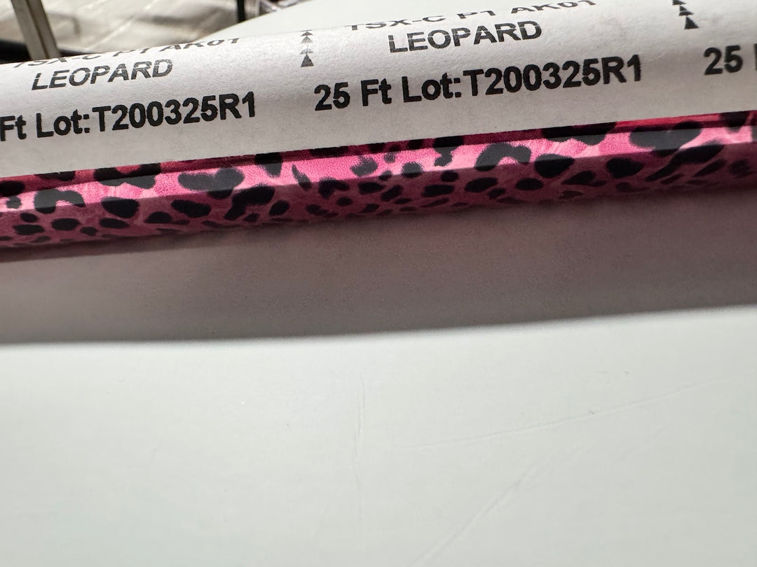 Roll of StarCraft Electra Foil in Leopard, hot pink with black leopard spots, in its printed mill band