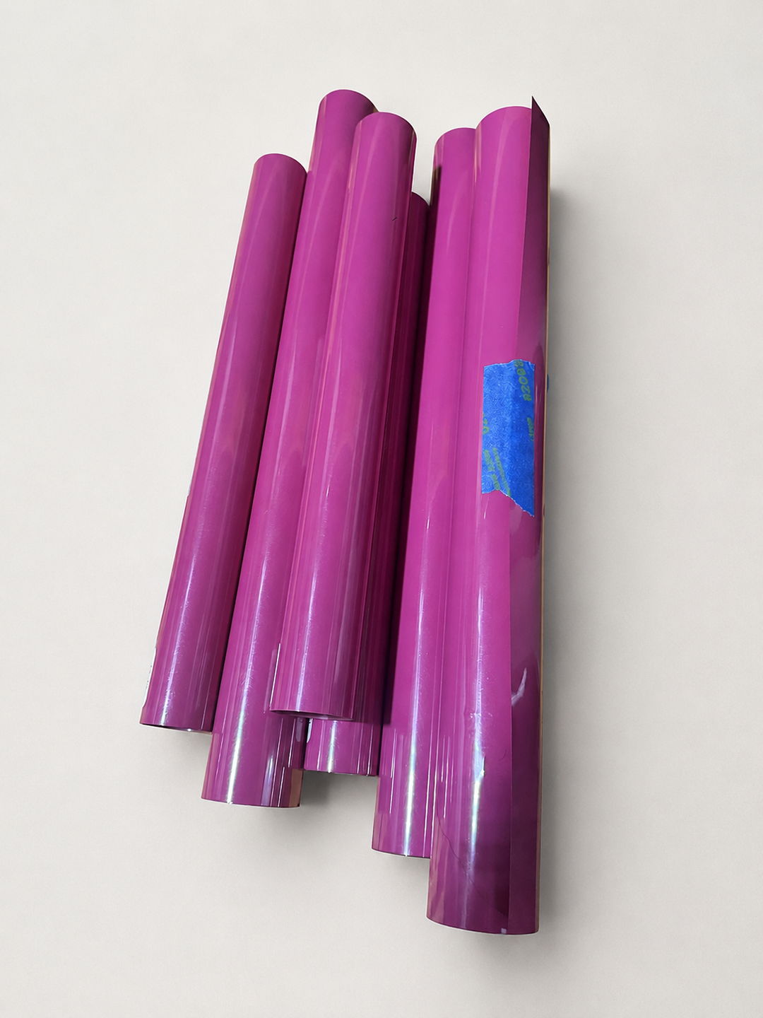 Rolls of Siser EasyWeed heat transfer vinyl in Magenta, a vivid purple-pink