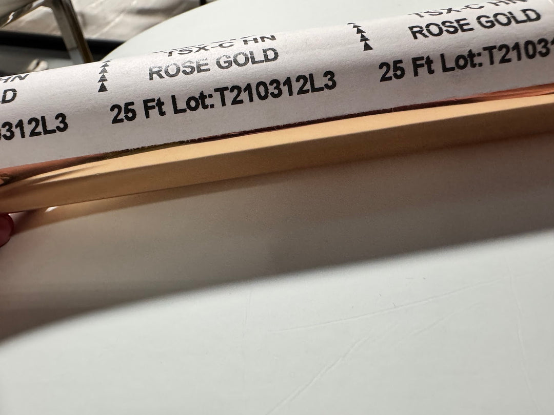 Roll of StarCraft Electra Foil in Rose Gold with a warm pink-gold mirror finish