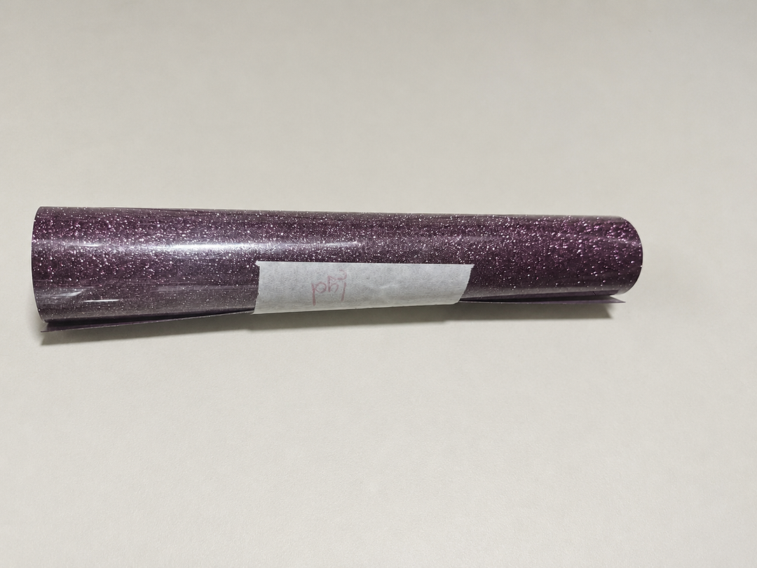 Single roll of Siser Glitter heat transfer vinyl in a dusty plum shade