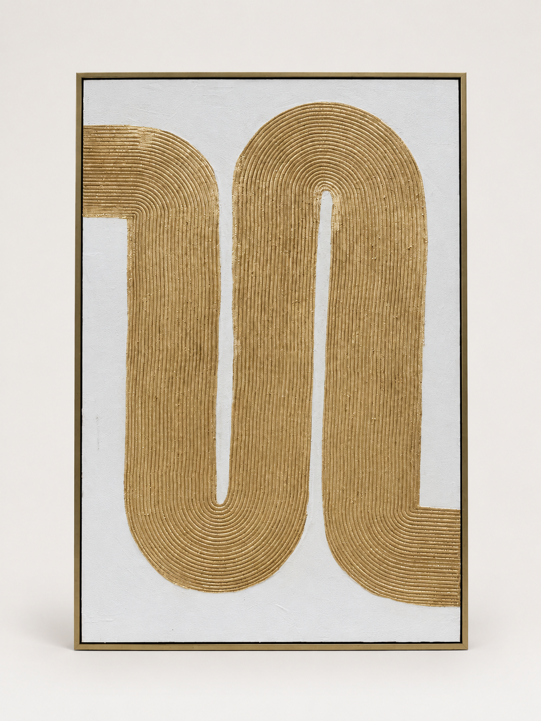 Gold rope coil sculptural wall art in a gold frame