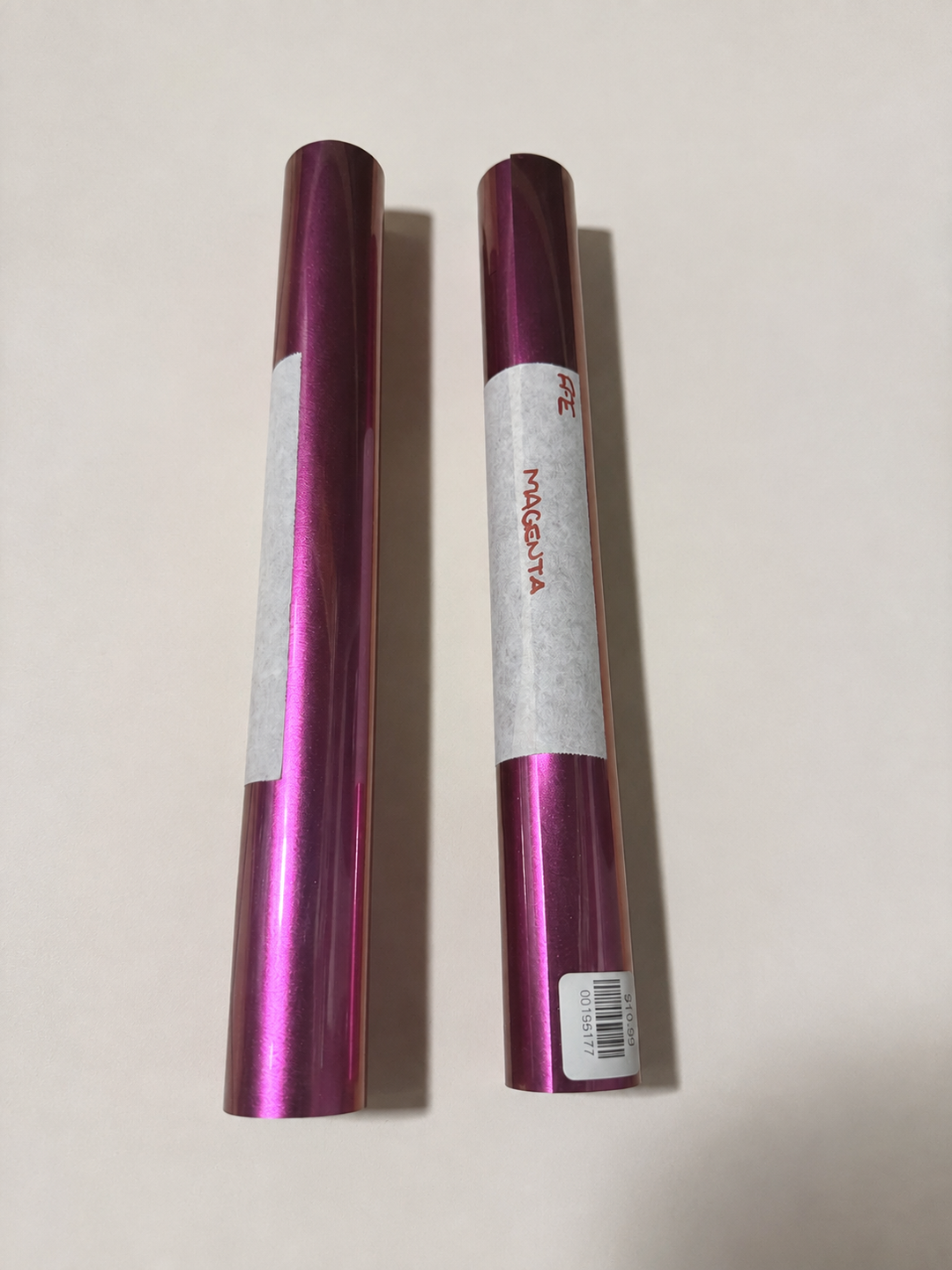 Rolls of Siser EasyWeed Electric heat transfer vinyl in Magenta with a metallic sheen