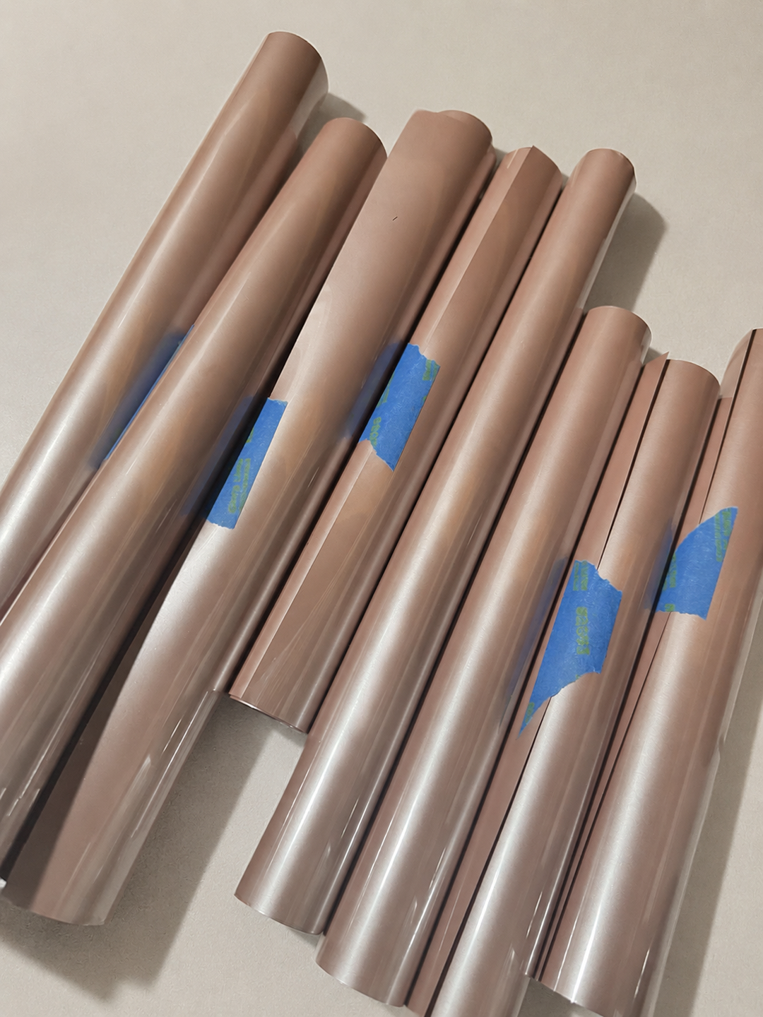 Rolls of Siser EasyWeed heat transfer vinyl in Dusty Rose, a muted pearl rose