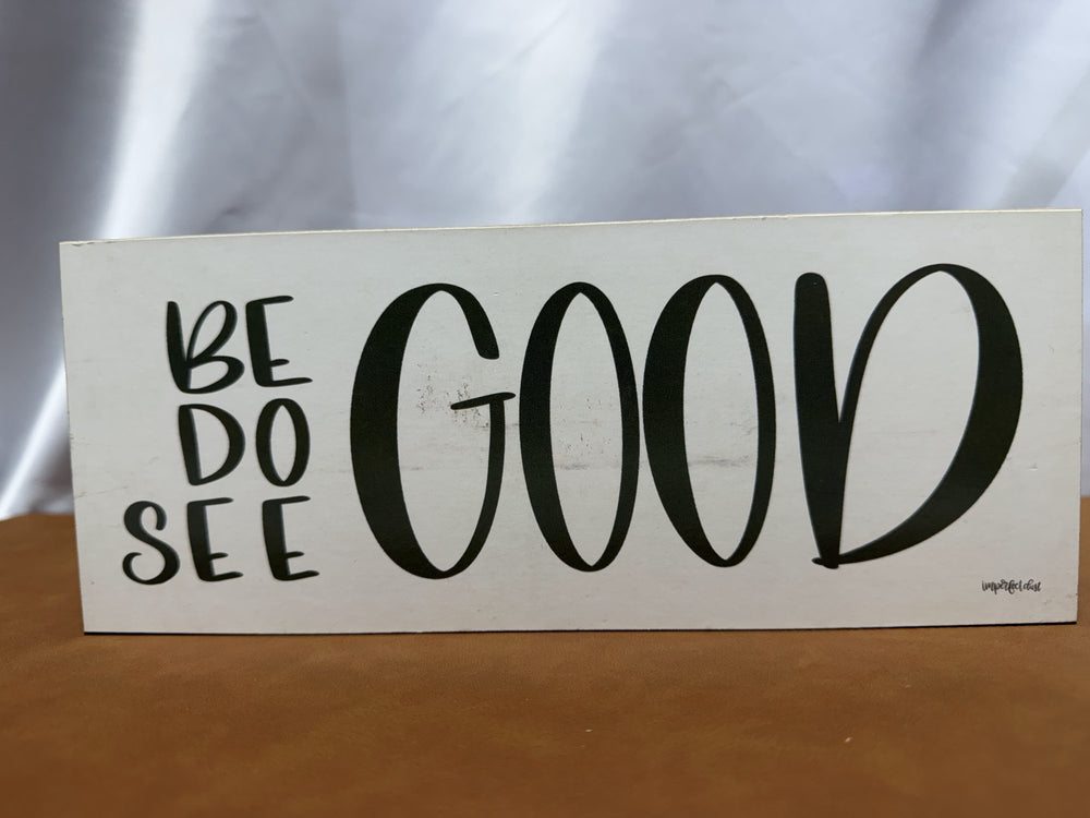 Wood sign reading Be Do See Good