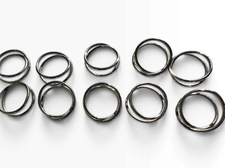 Lot 25 – Silver Twisted Loop Napkin Rings, Set of 10