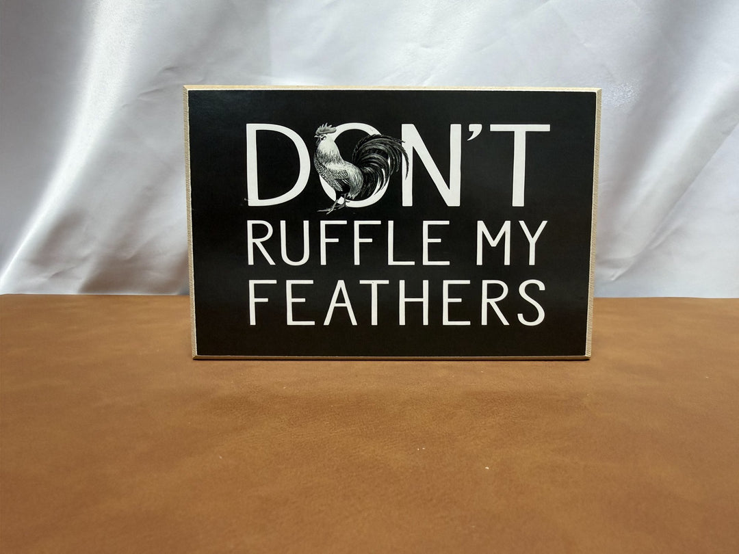 Wood sign with rooster reading Don't Ruffle My Feathers
