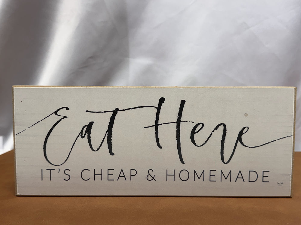 Wood sign reading Eat Here It's Cheap and Homemade