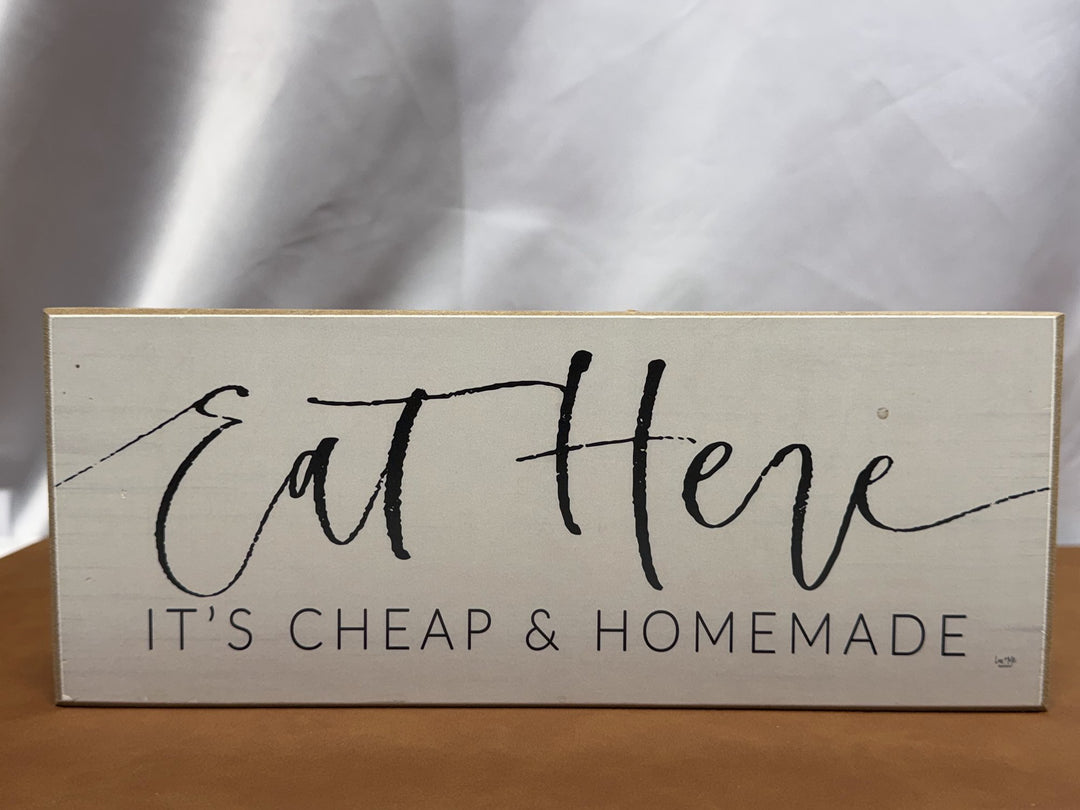 Wood sign reading Eat Here It's Cheap and Homemade