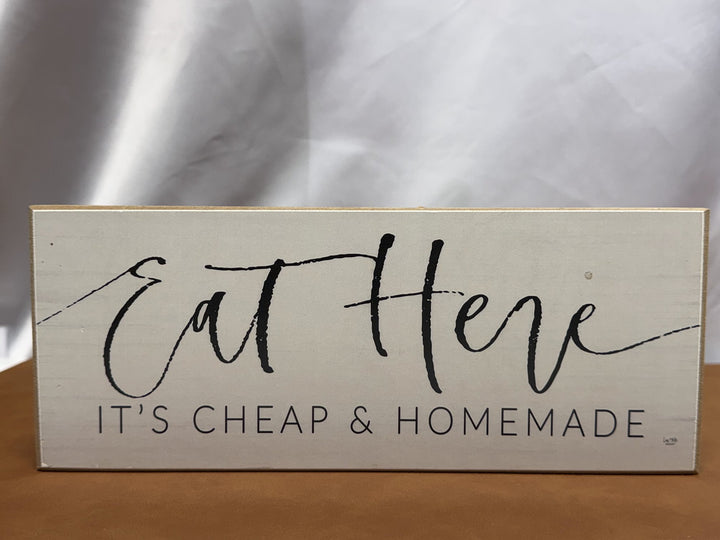 Wood sign reading Eat Here It's Cheap and Homemade