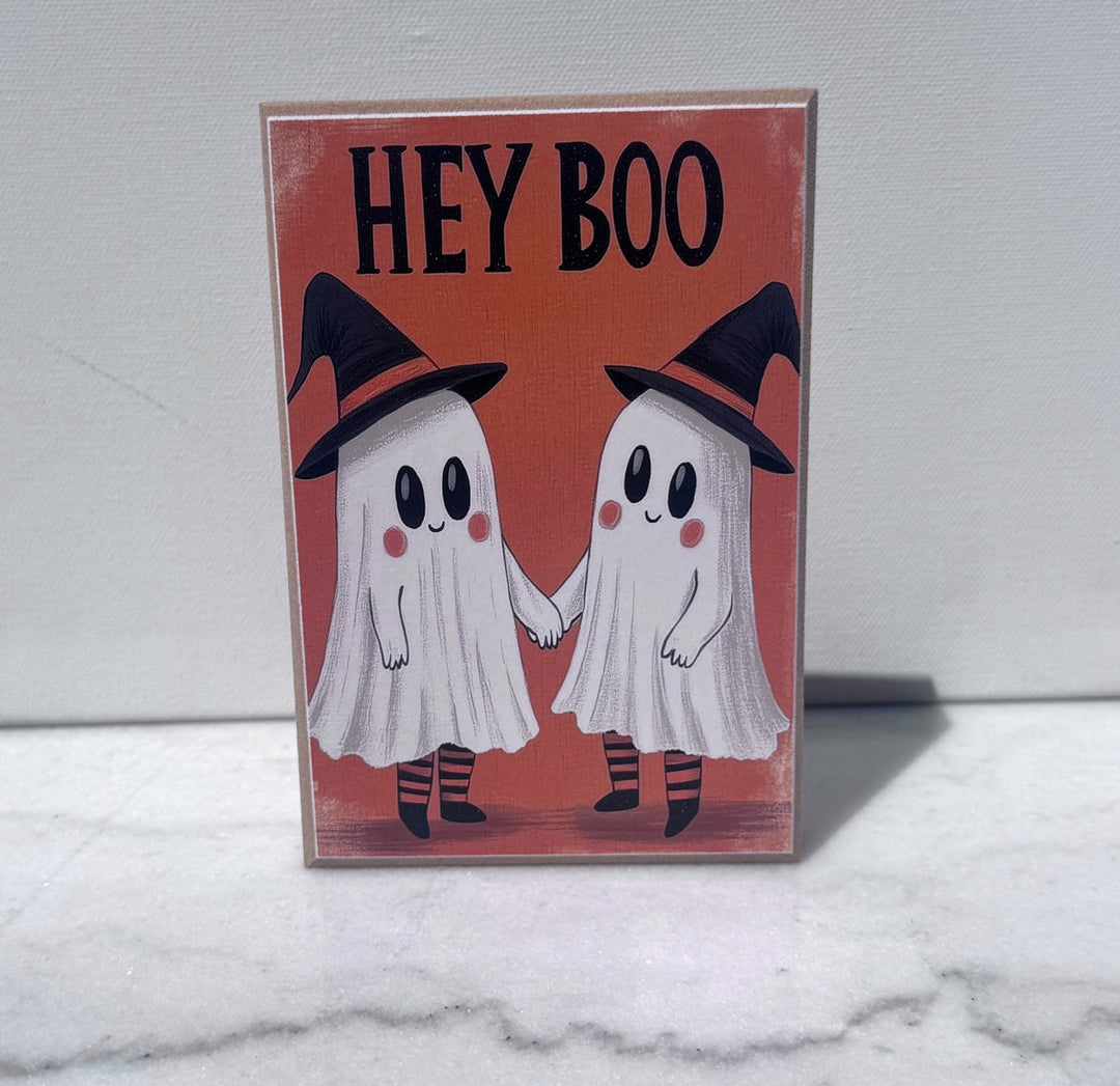 Hey Boo sign with two ghost friends holding hands