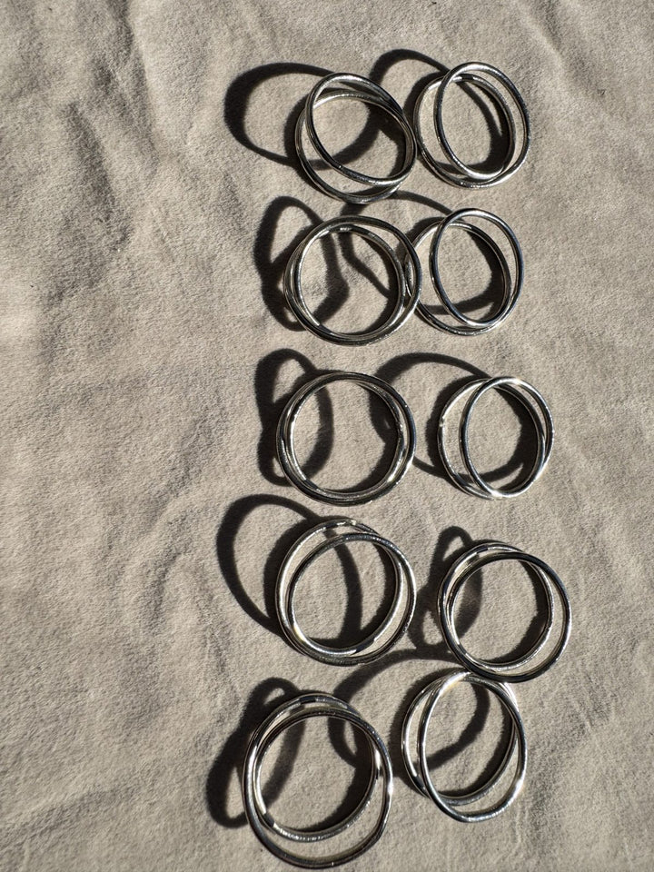 Lot 25 – Silver Twisted Loop Napkin Rings, Set of 10