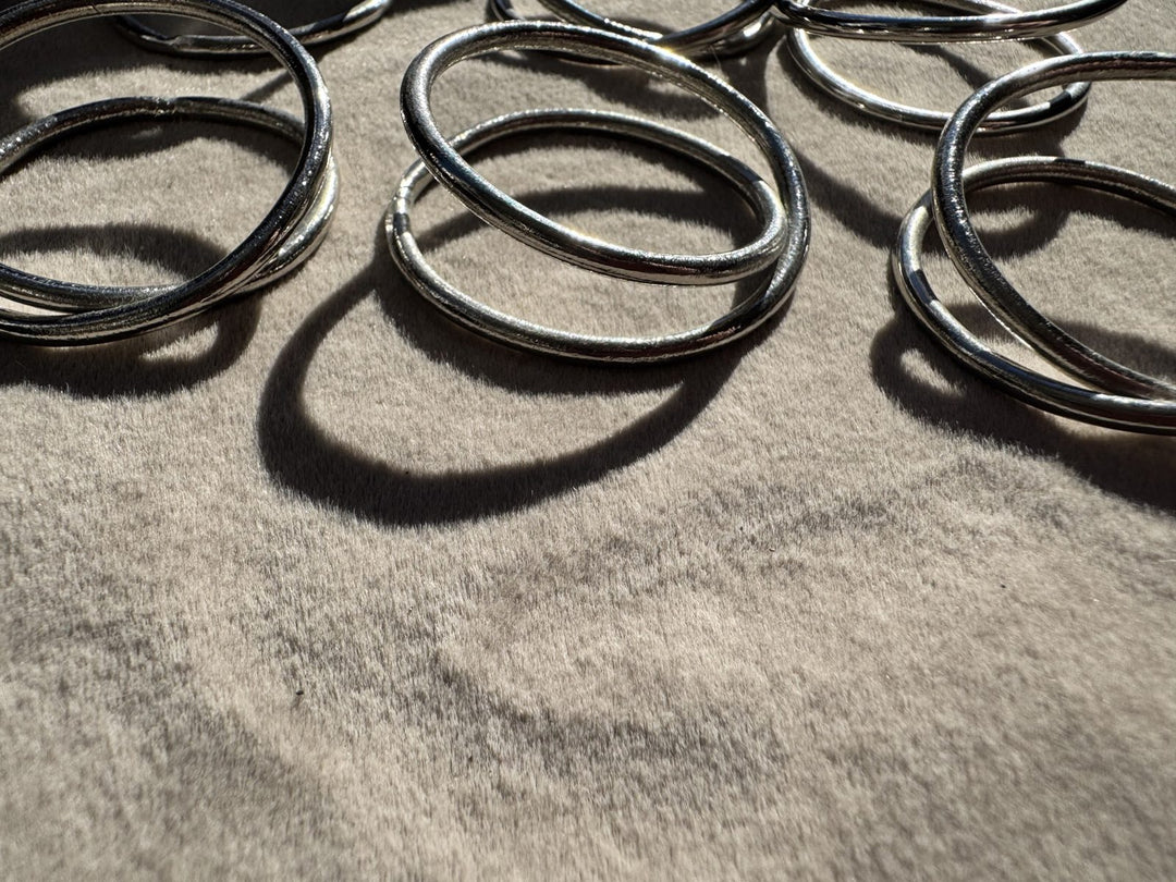 Lot 25 – Silver Twisted Loop Napkin Rings, Set of 10