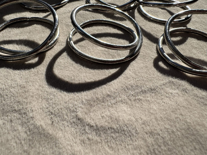 Lot 25 – Silver Twisted Loop Napkin Rings, Set of 10