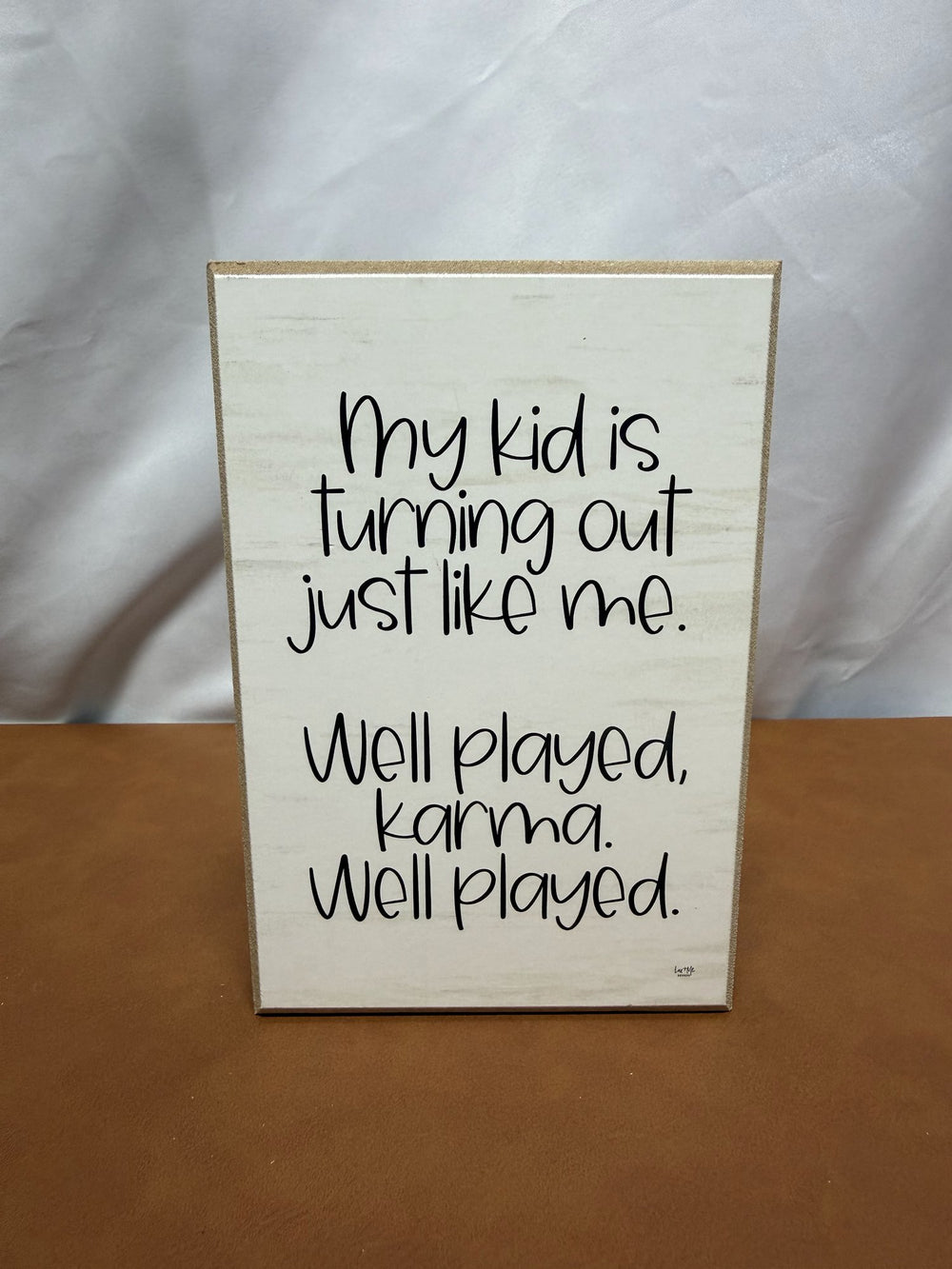 Wood sign reading My kid is turning out just like me, well played karma