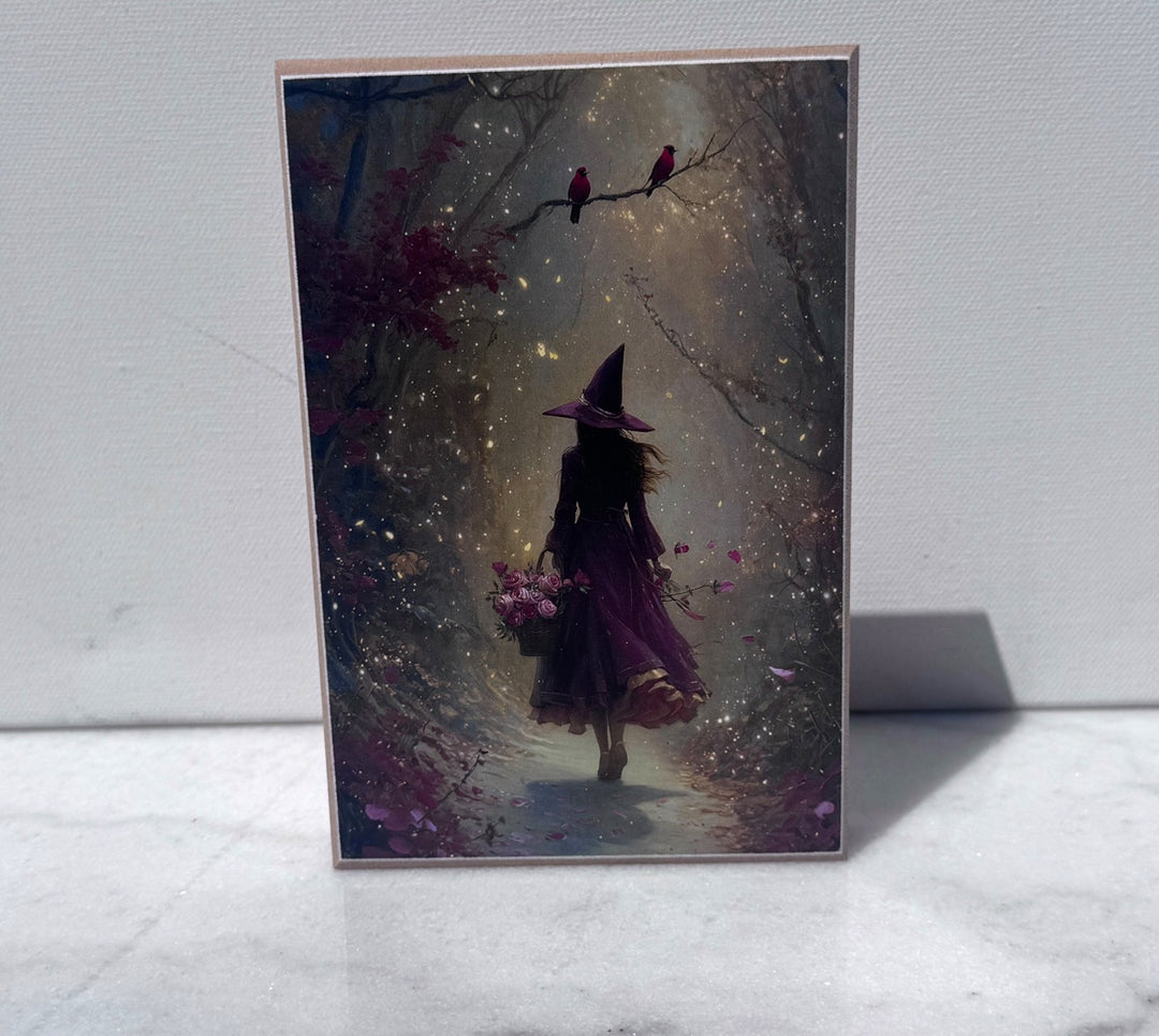 Witch walking down a glittering forest path canvas print