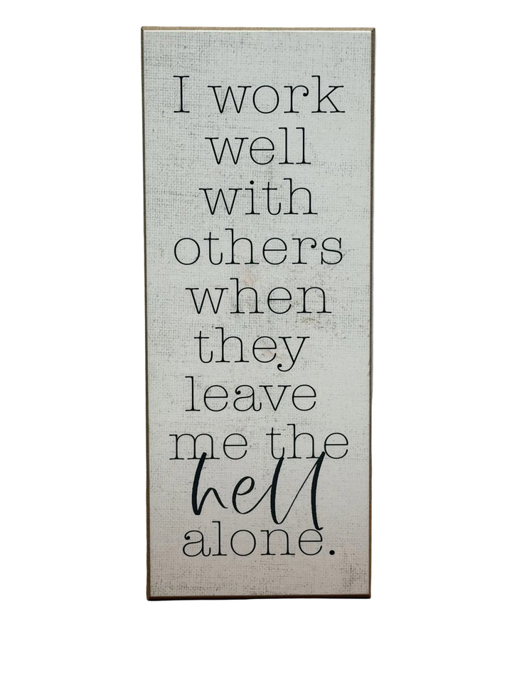 Wood sign reading I work well with others when they leave me the hell alone