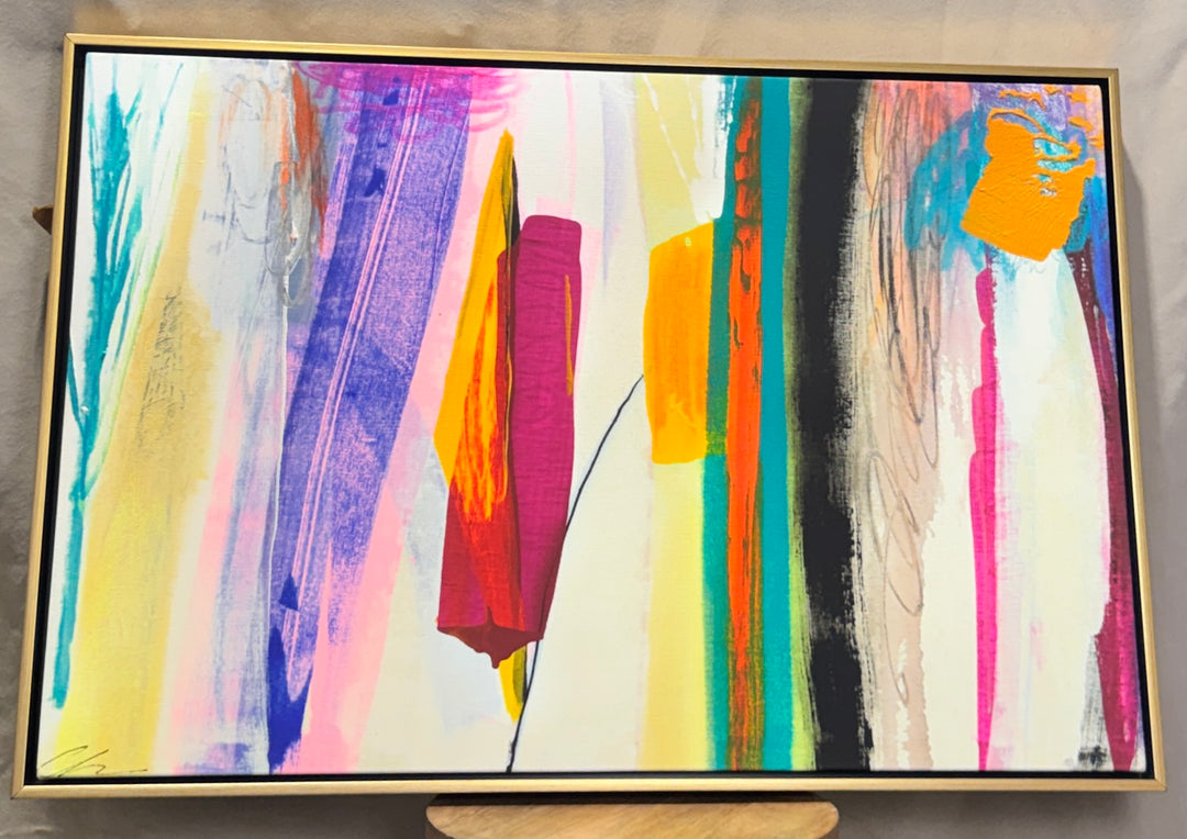 Bold multicolor abstract wall art in a slim gold frame