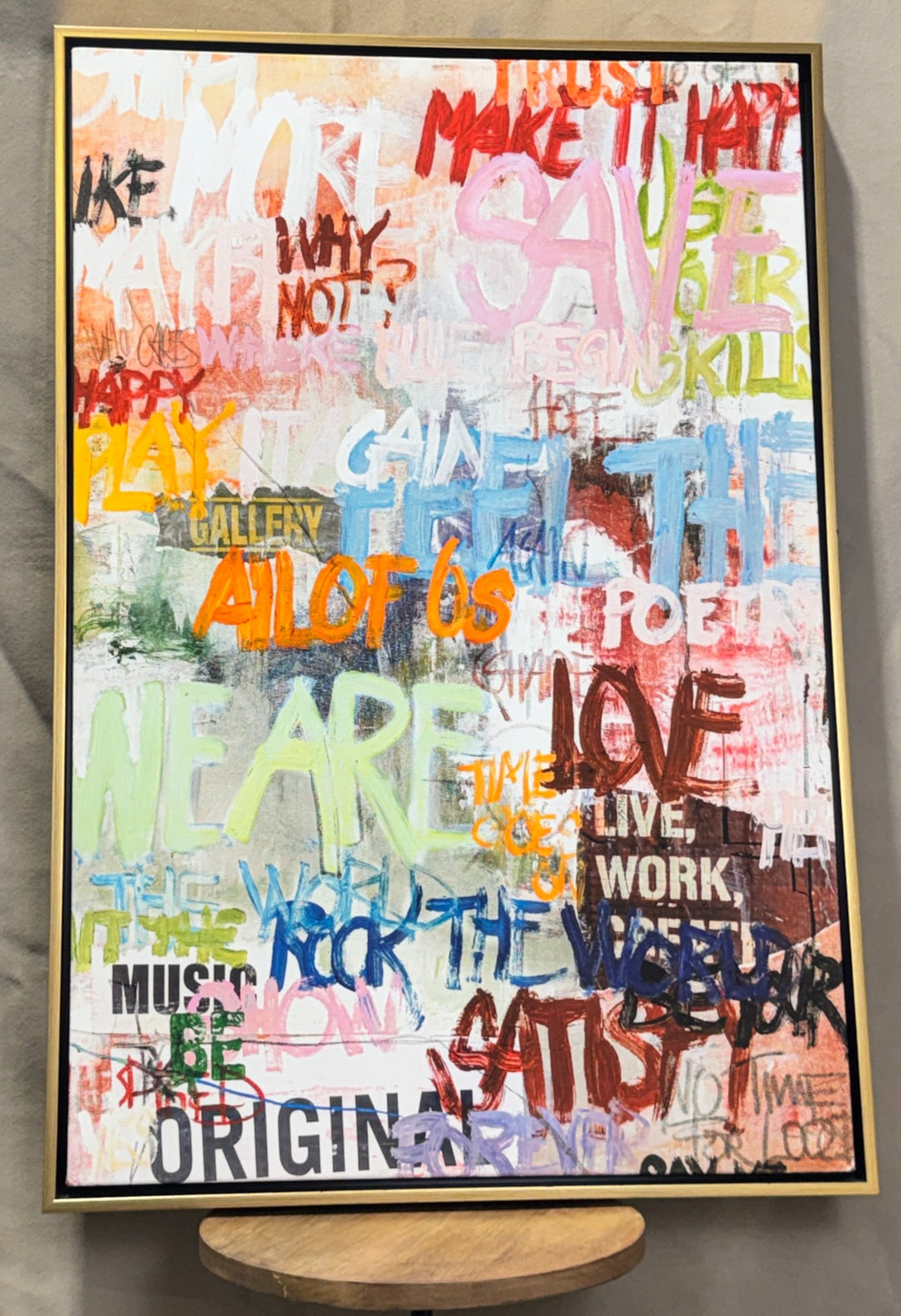 Colorful graffiti typography abstract canvas in a gold frame