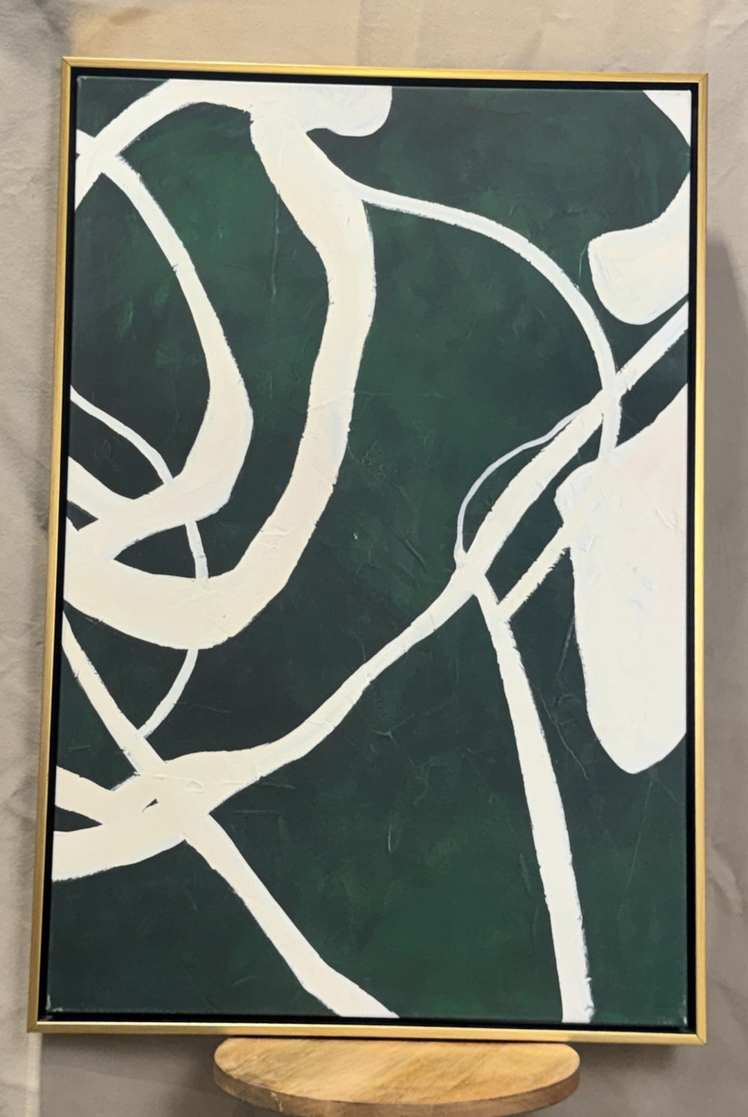 Dark green and white modern abstract canvas in a slim gold frame