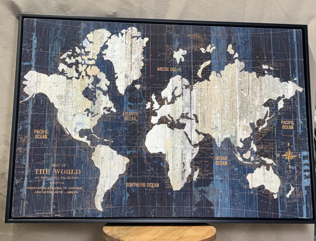 Navy, cream and gold vintage-style world map in a black frame