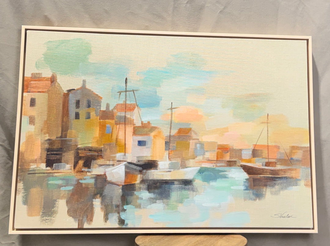Pastel coastal harbor and boats wall art in a light frame