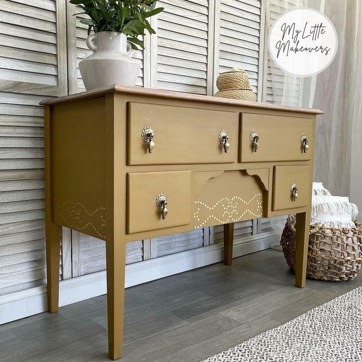 Golden yellow desk with nailhead trim stencil and gold hardware painted in Mojave