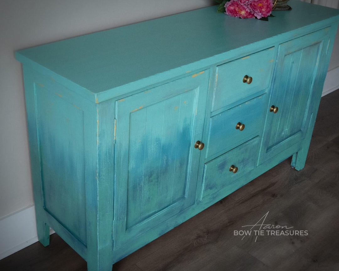 Entertainment center painted in layered blue Terra Clay Paint colors