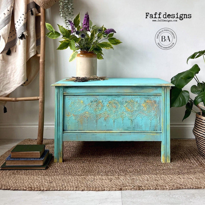 Coffee table painted in Lani's Lagoon Terra Clay Paint with a raised lotus stencil