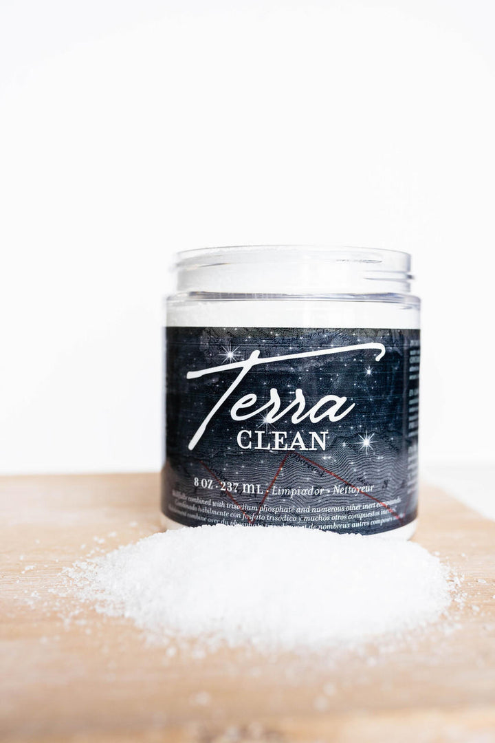 Open jar of Terra Clean powder concentrate on a table